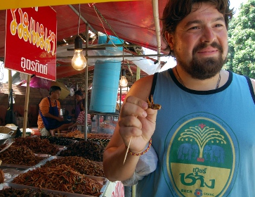 Adam snacking on giant grasshoppers (1)
