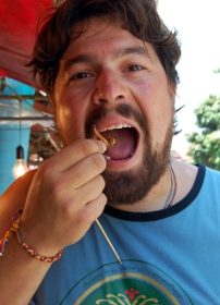 Adam snacking on giant grasshoppers (2)