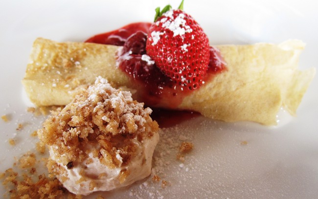 Crepe filled with tembleque and a strawberry comfit at Crispy y Relleno in Pinones, Puerto Rico